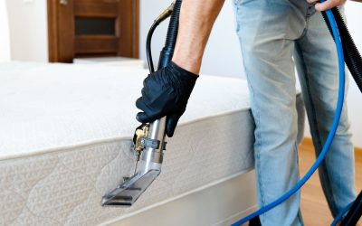 Cleaning,Concept.,Cleaner,Cleans,Bed,In,The,Bedroom,,Close,Up. Cleaning,Concept.,Cleaner,Cleans,Bed,In,The,Bedroom,,Close,Up.